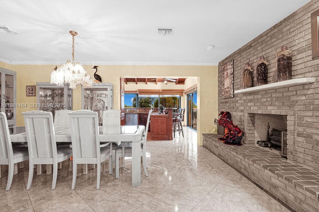 9291 Southwest 36th Street Miami, FL 33165 - Photo 7 of 15 a view of a dining room with furniture window and outside view