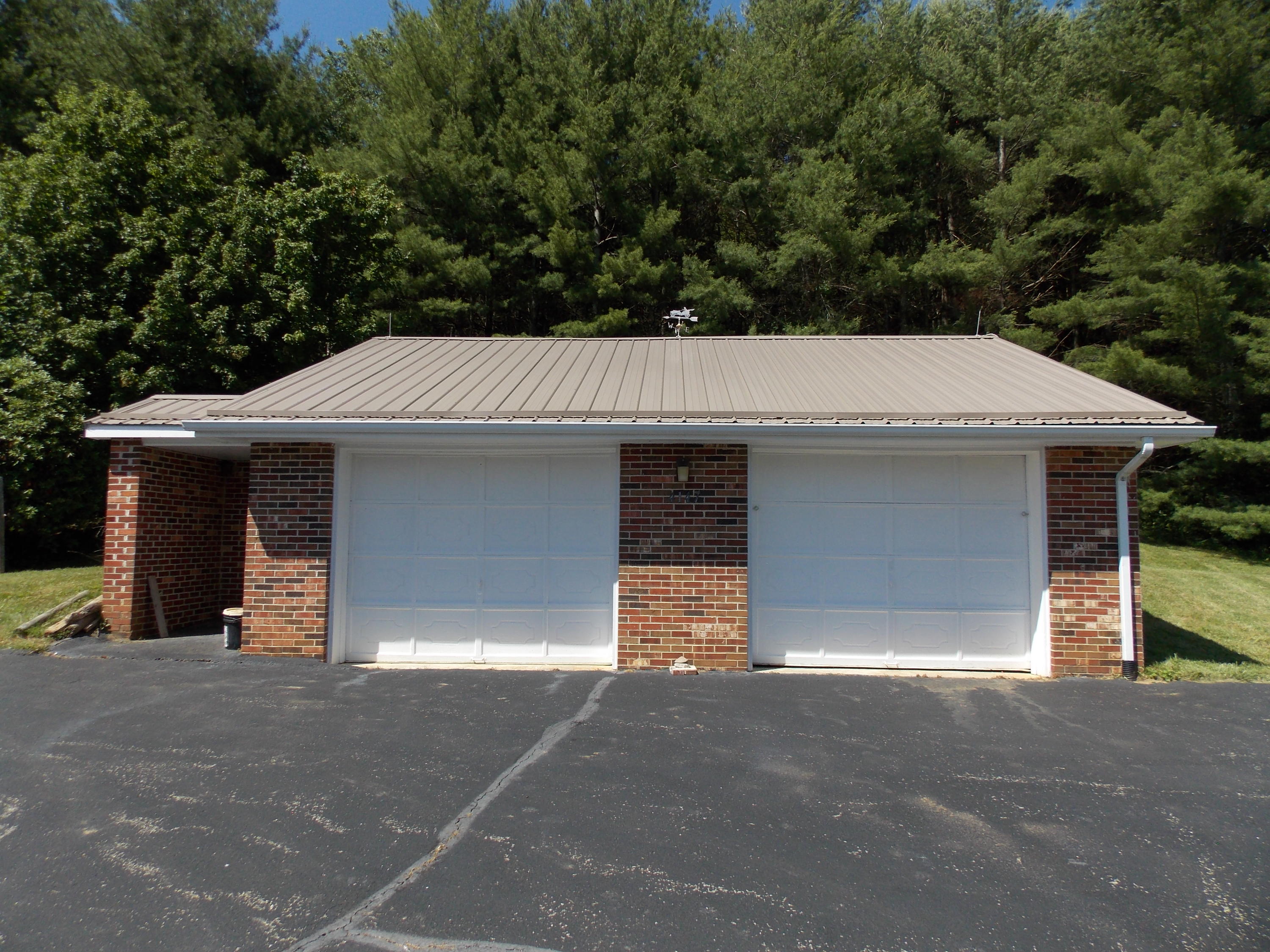 4147 Webbs Mill Road North Riner, VA 24149 - Photo 13 of 53 a view of a house with a garage and yard