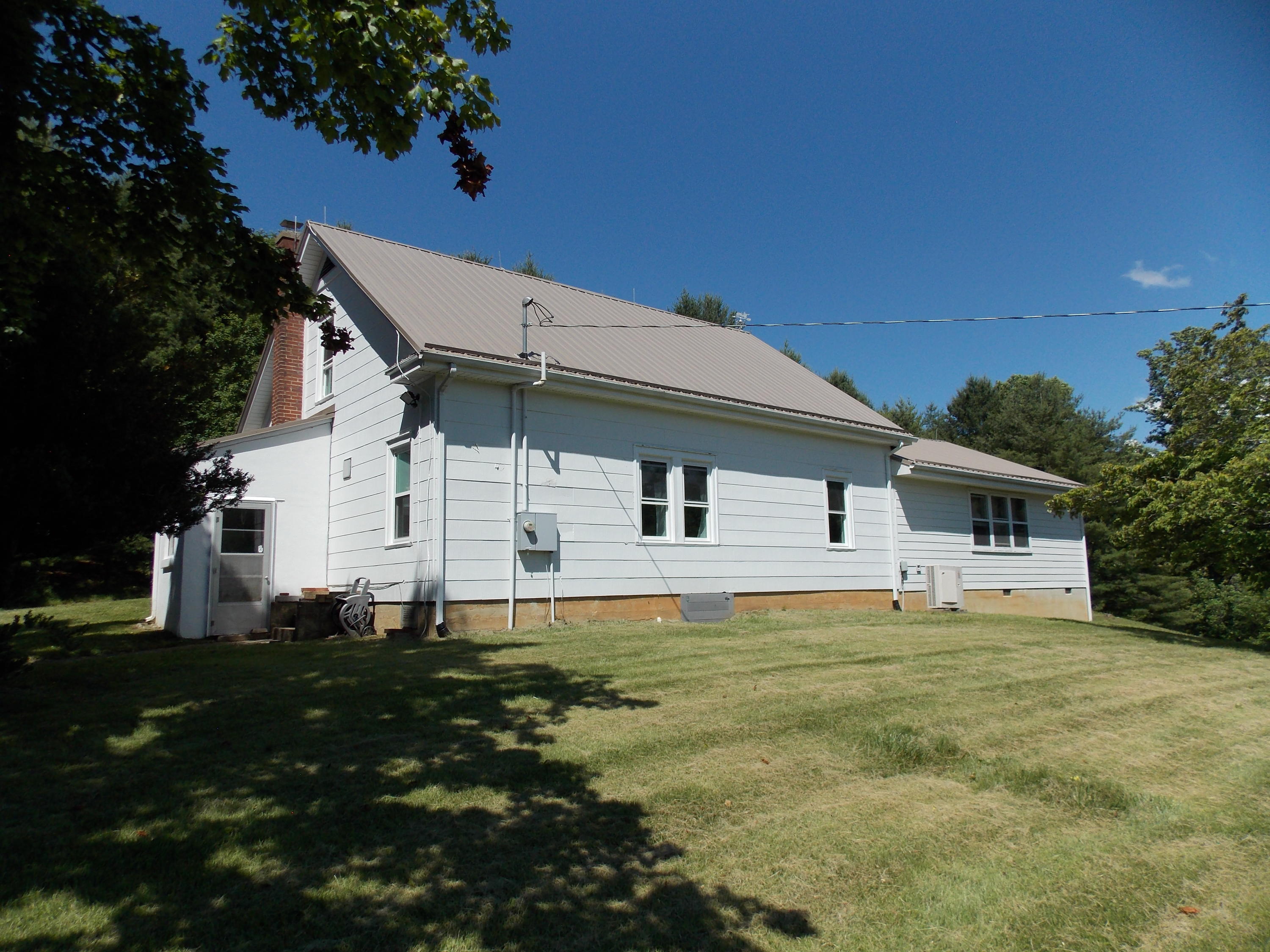 4147 Webbs Mill Road North Riner, VA 24149 - Photo 6 of 53 a front view of a house with a garden
