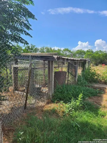 a view of a lake with a house in the background