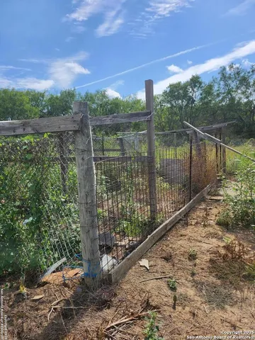 a view of a yard and a balcony
