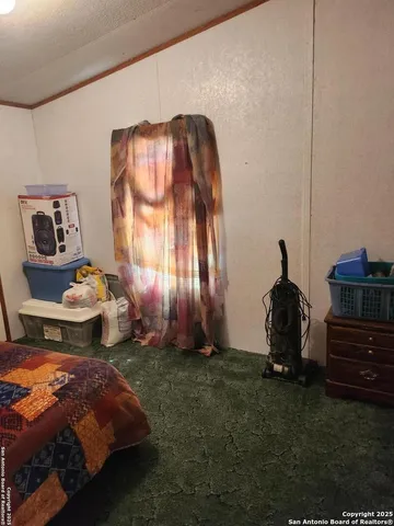 a bedroom with a bed and cabinets