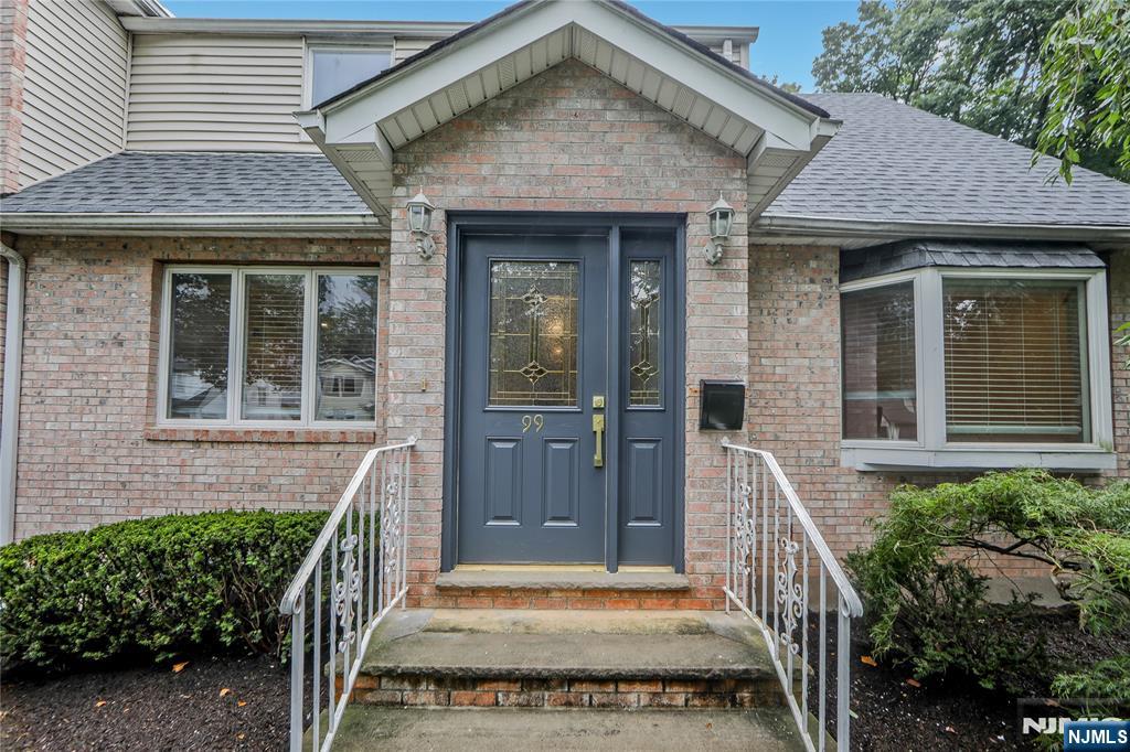 99 Park Avenue Cresskill, NJ 07626 - Photo 25 of 46 a front view of a house with a porch