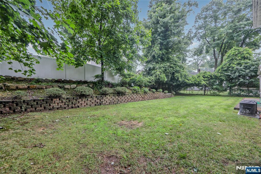 99 Park Avenue Cresskill, NJ 07626 - Photo 26 of 46 a view of a field of grass and trees