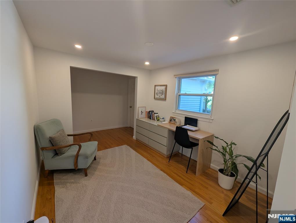 99 Park Avenue Cresskill, NJ 07626 - Photo 35 of 46 a living room with furniture and a flat screen tv