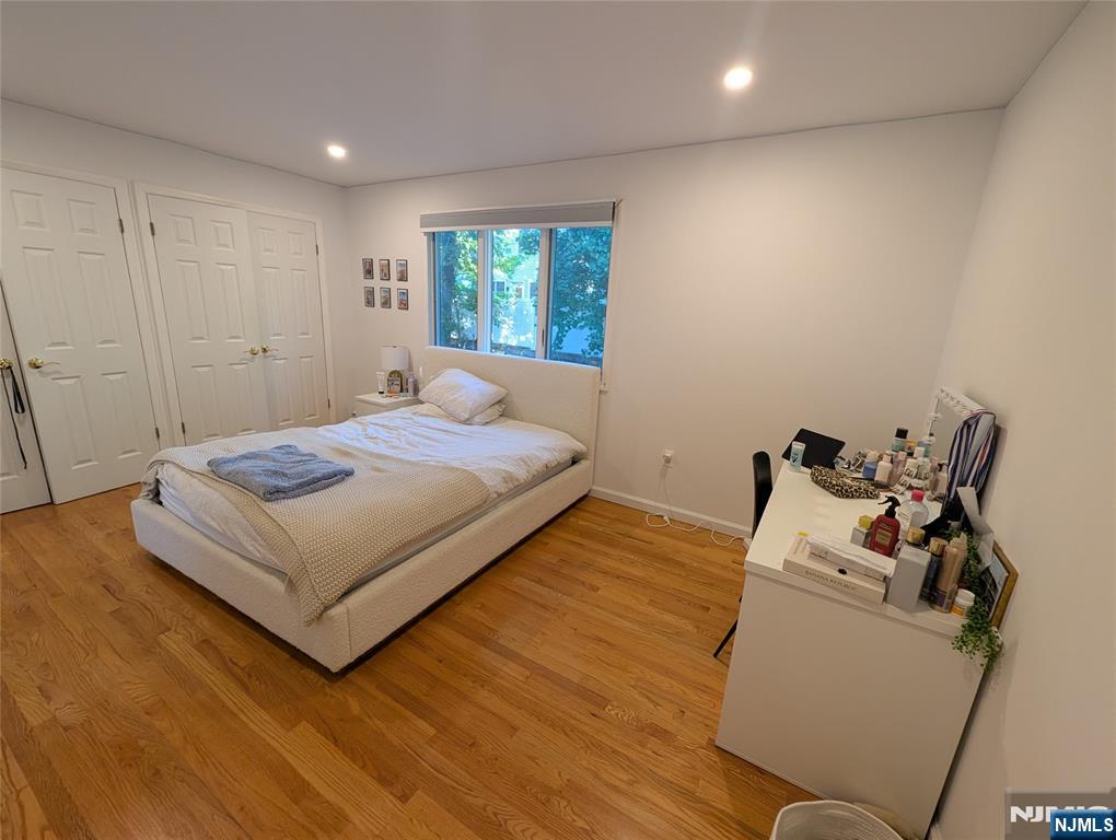 99 Park Avenue Cresskill, NJ 07626 - Photo 37 of 46 a bedroom with a bed and wooden floor