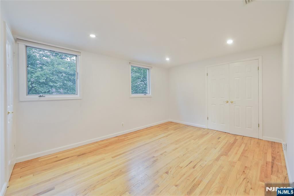 99 Park Avenue Cresskill, NJ 07626 - Photo 38 of 46 a view of empty room with wooden floor and fan