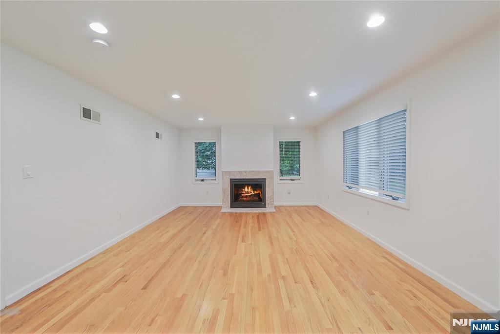 99 Park Avenue Cresskill, NJ 07626 - Photo 42 of 46 a view of an empty room with wooden floor and a window