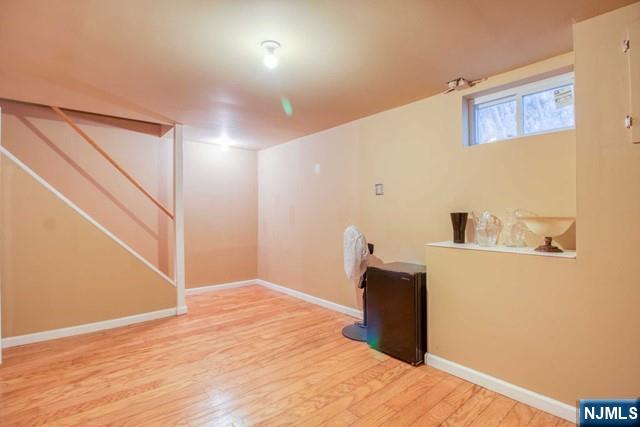 99 Park Avenue Cresskill, NJ 07626 - Photo 43 of 46 a bedroom with a bed and wooden floor