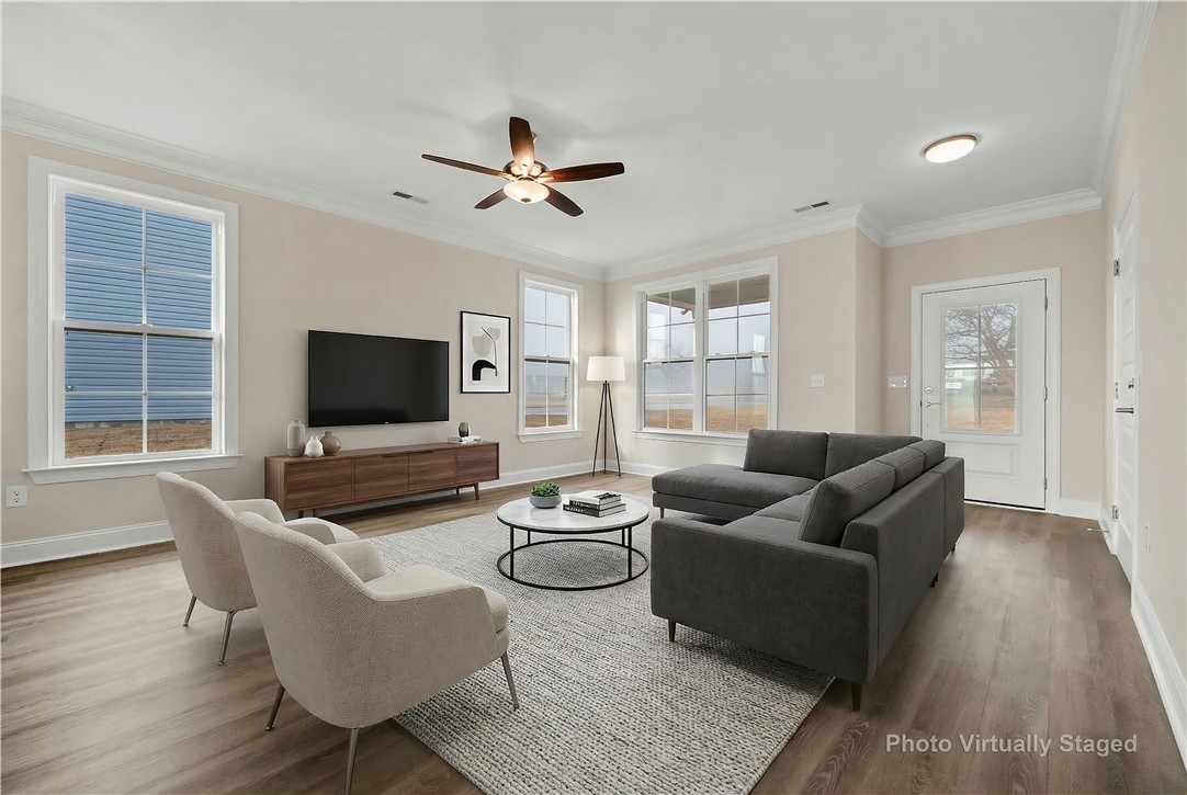 112 Oak Grove Road Norris, SC 29667 - Photo 2 of 19 This bright living space features elegant hardwood flooring and ample natural light, creating an inviting atmosphere.