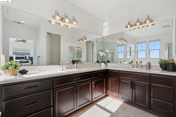 a bath tub sitting next to a bathroom sink
