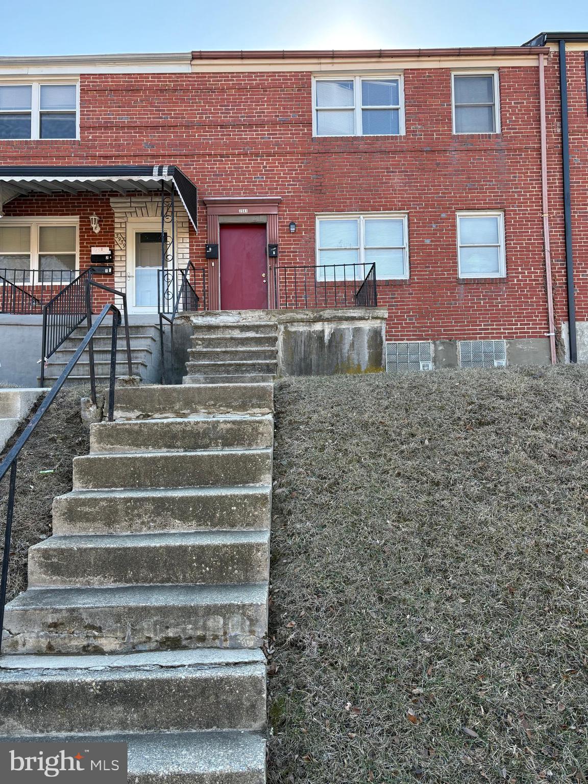 3941 Stokes Drive, Unit 1 Baltimore, MD 21229 - Photo 1 of 21 a front view of a house with stairs
