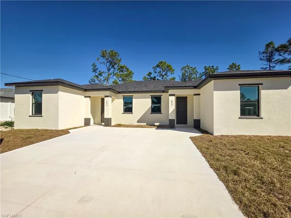 a very nice looking house with a large window