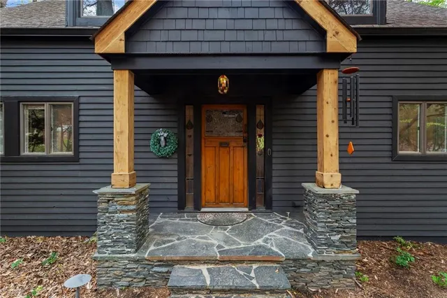 a front view of a house with garden