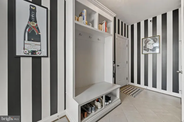 a hallway with painting and a mirror