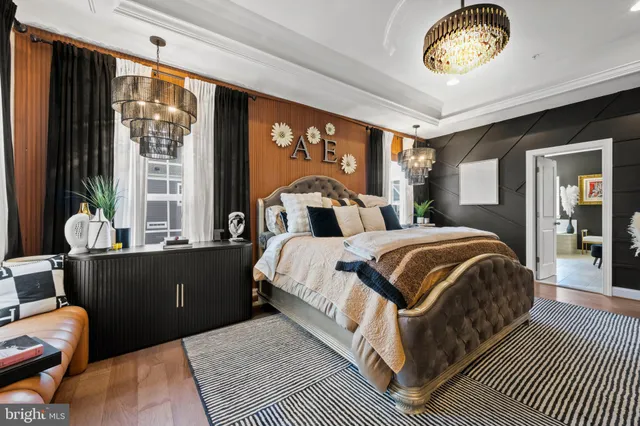 a bedroom with a large bed and a large window