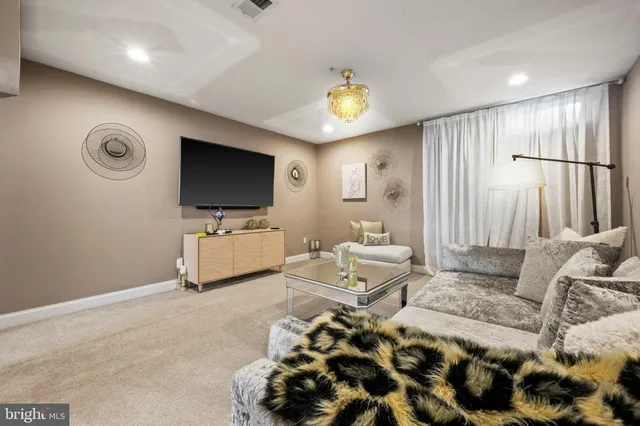 a living room with furniture and a couch