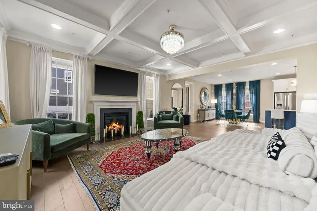 a bedroom with furniture and a fireplace