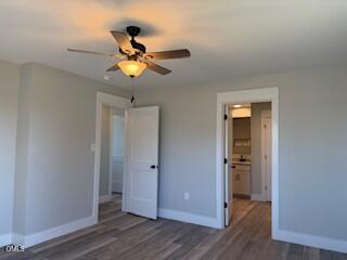 3055 Autry Mill Road Godwin, NC 28344 - Photo 13 of 21 a view of a chandelier fan and wooden floor