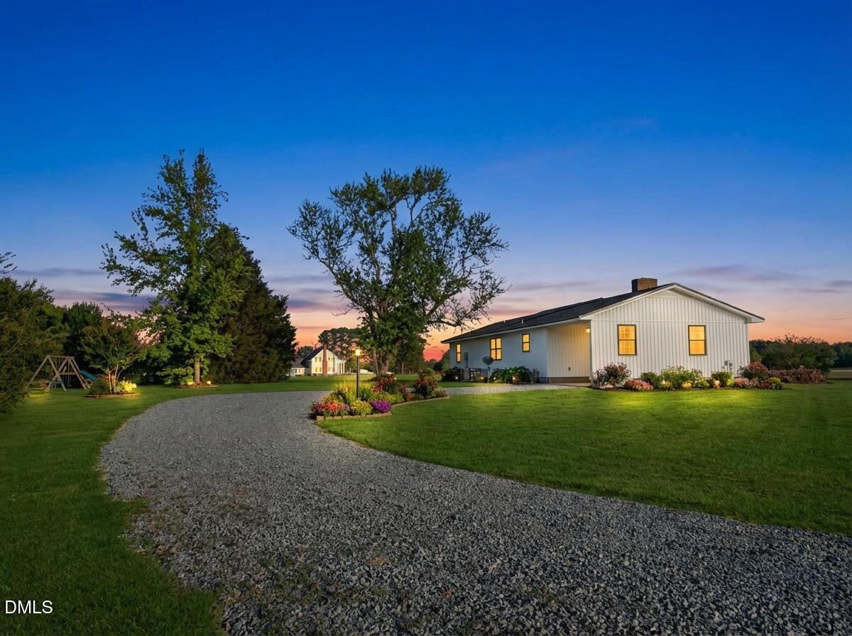 3055 Autry Mill Road Godwin, NC 28344 - Photo 19 of 21 a front view of a house with a yard