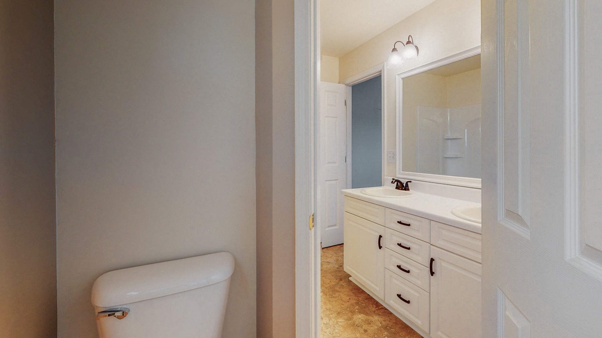 4660 Southside Road Southside, TN 37171 - Photo 40 of 48 a bathroom with a double vanity sink toilet and mirror