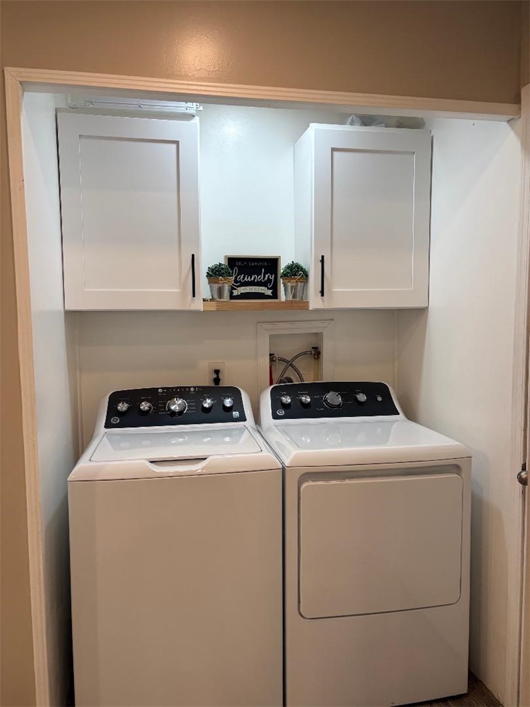 1395 Lause Road Bullhead City, AZ 86442 - Photo 24 of 34 Dedicated laundry area featuring white shaker-style cabinetry with matte black hardware and wood-finish floating shelf