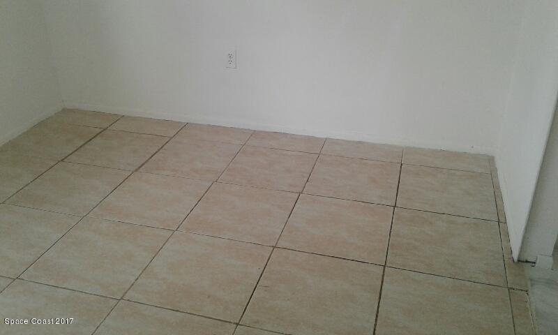 449 Archer Road Southeast, Unit 10 Palm Bay, FL 32909 - Photo 7 of 7 Archer Lvng rm Floor