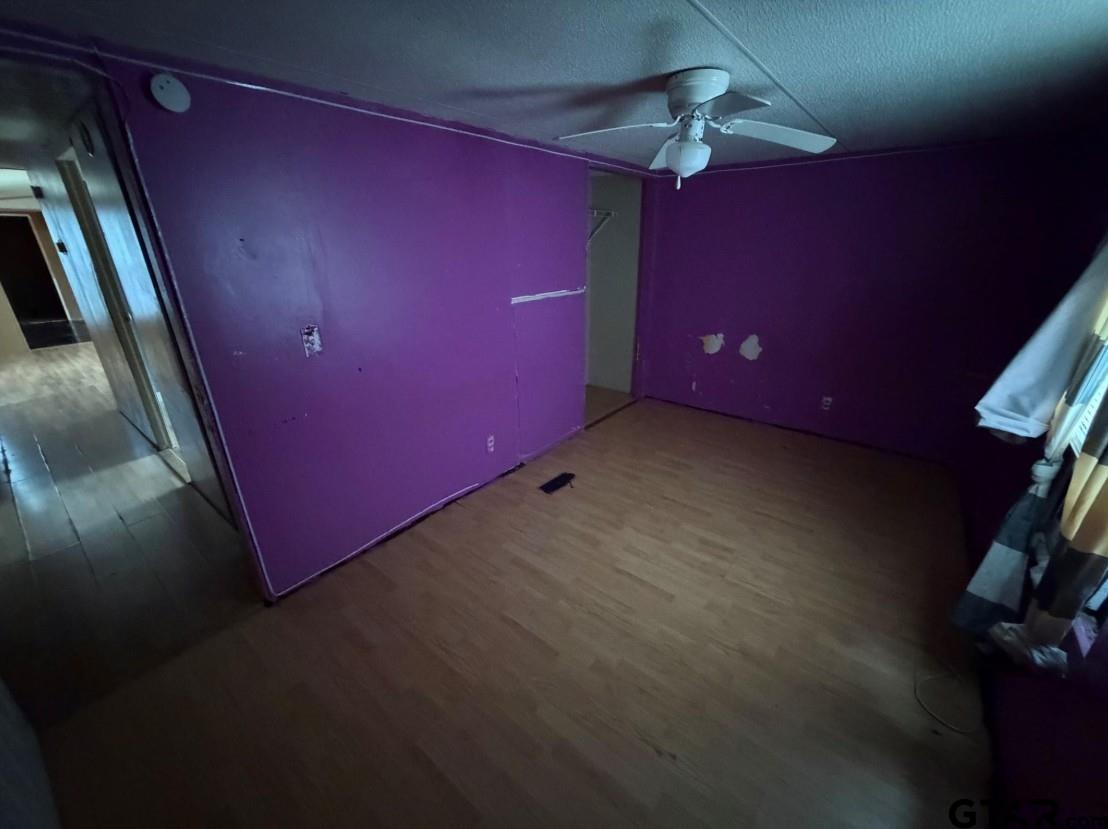 12611 Fannin Parkway Tyler, TX 75708 - Photo 12 of 15 a view of a livingroom with a ceiling fan and window