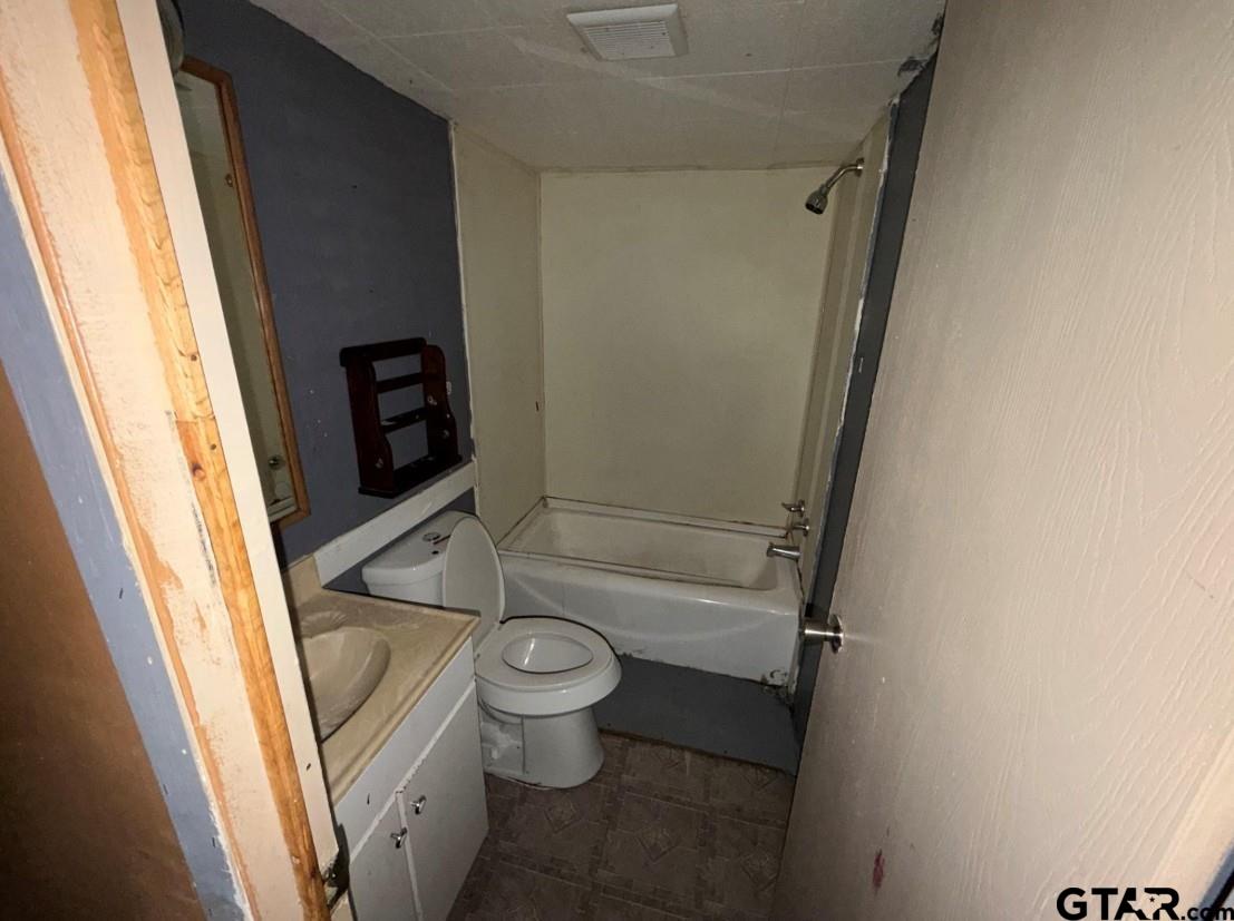 12611 Fannin Parkway Tyler, TX 75708 - Photo 13 of 15 a bathroom with a sink and toilet