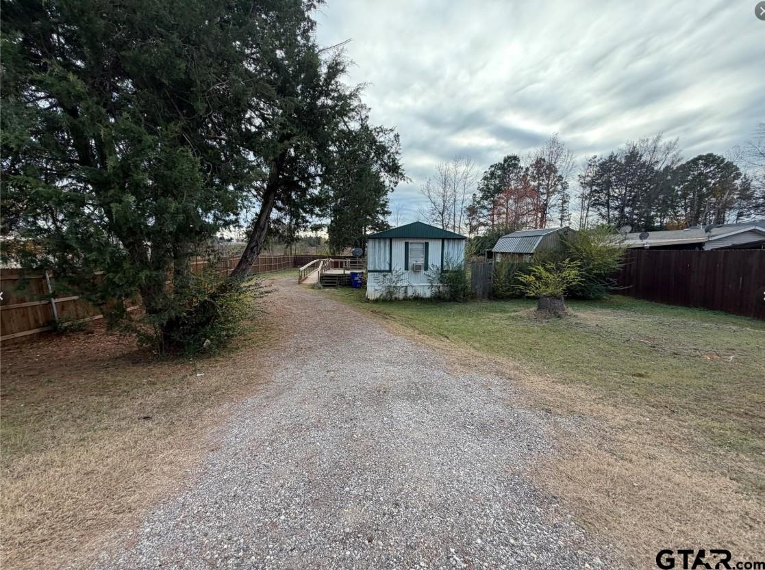 12611 Fannin Parkway Tyler, TX 75708 - Photo 2 of 15 a view of a house with a yard and sitting area