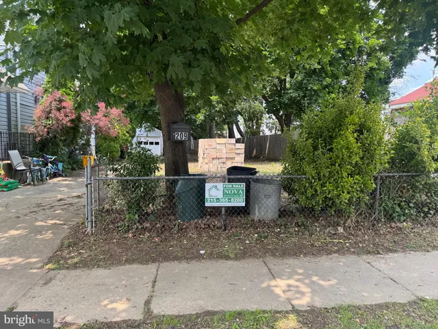 a backyard of a house with yard and trampoline
