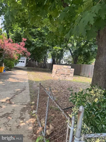 a view of backyard with a patio