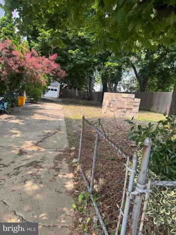 a view of a backyard with sitting area
