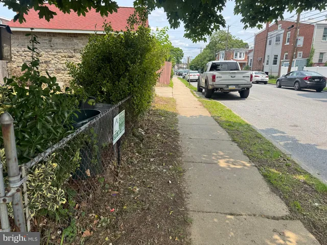 a view of a car park in front of a house