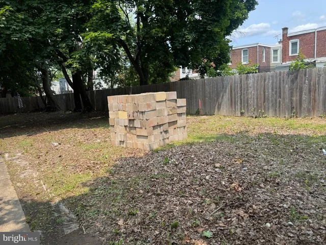 a view of a bench in a backyard