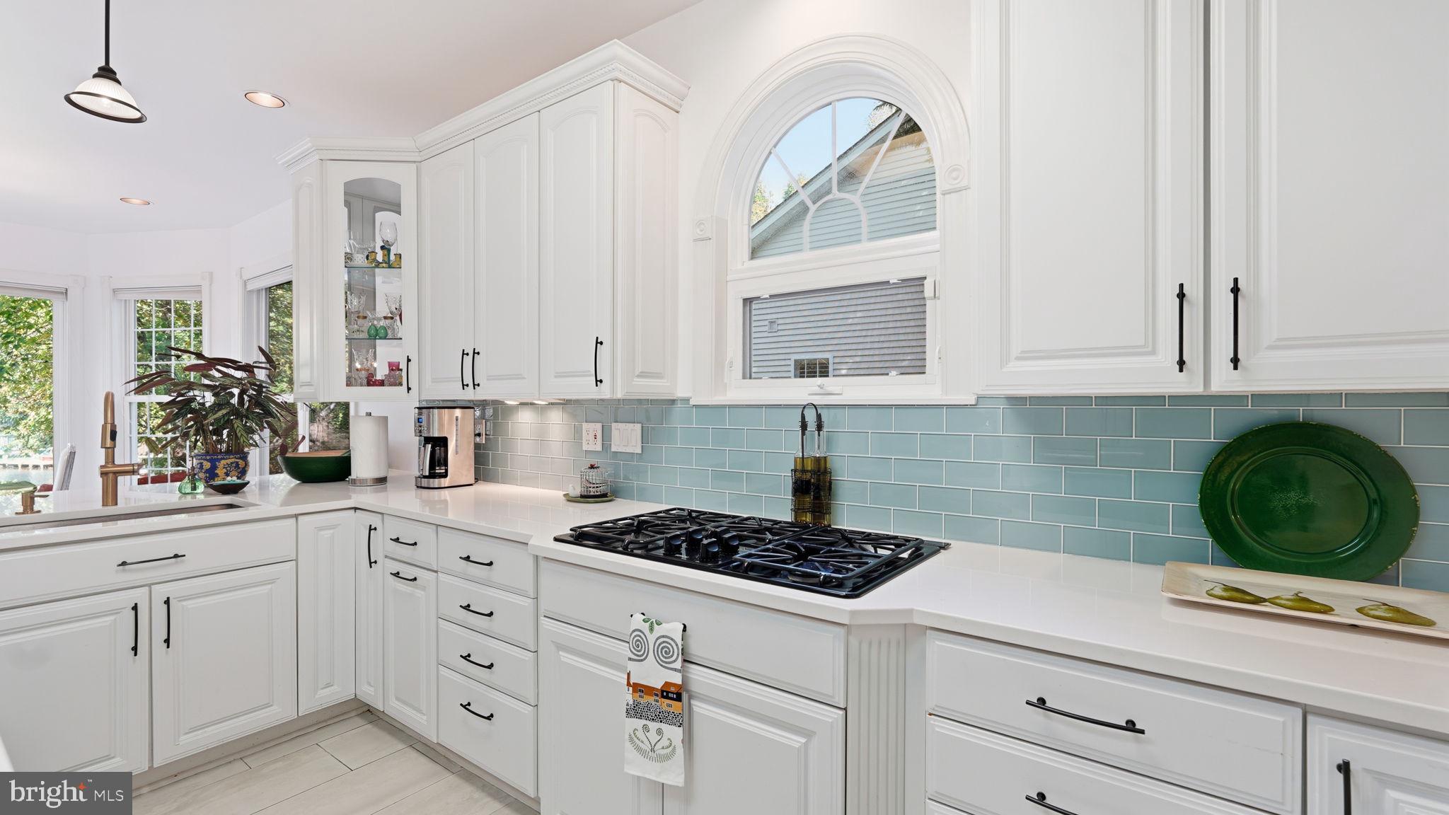 143 Edgemont Circle Locust Grove, VA 22508 - Photo 11 of 85 a kitchen with white cabinets and appliances