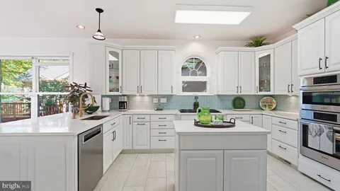 a bathroom with a sink mirror and toilet