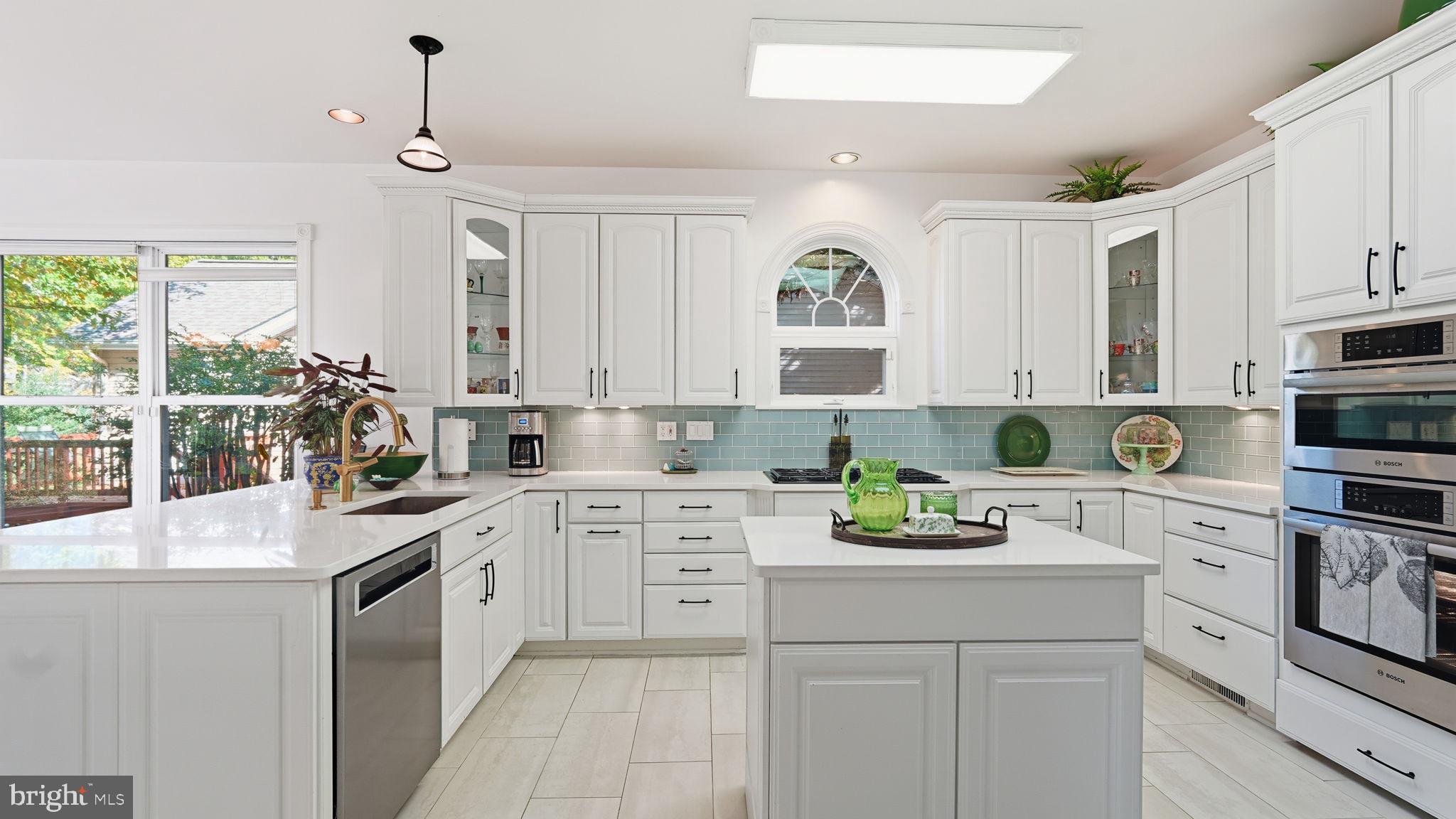 143 Edgemont Circle Locust Grove, VA 22508 - Photo 12 of 85 a kitchen with kitchen island white cabinets and white appliances