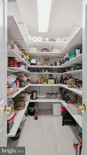 a bathroom with a sink and mirror with toilet