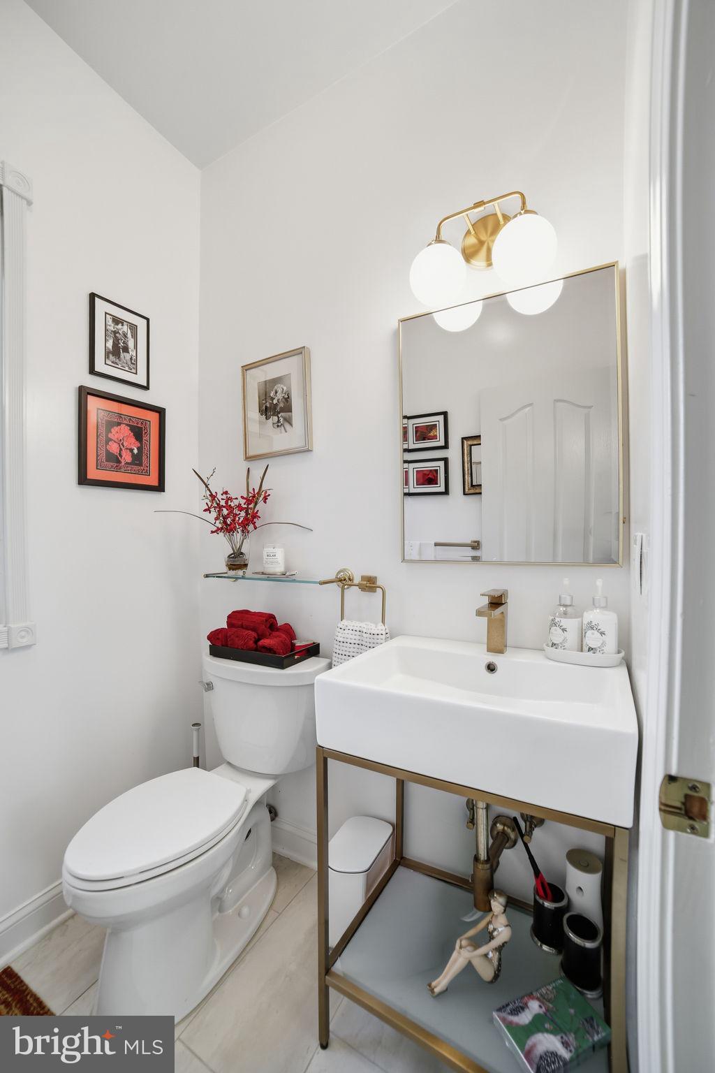 143 Edgemont Circle Locust Grove, VA 22508 - Photo 24 of 85 a bathroom with a sink mirror and toilet