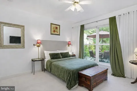 a living room with large lots of furniture and a book shelf