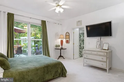 a living room with furniture and a book shelf