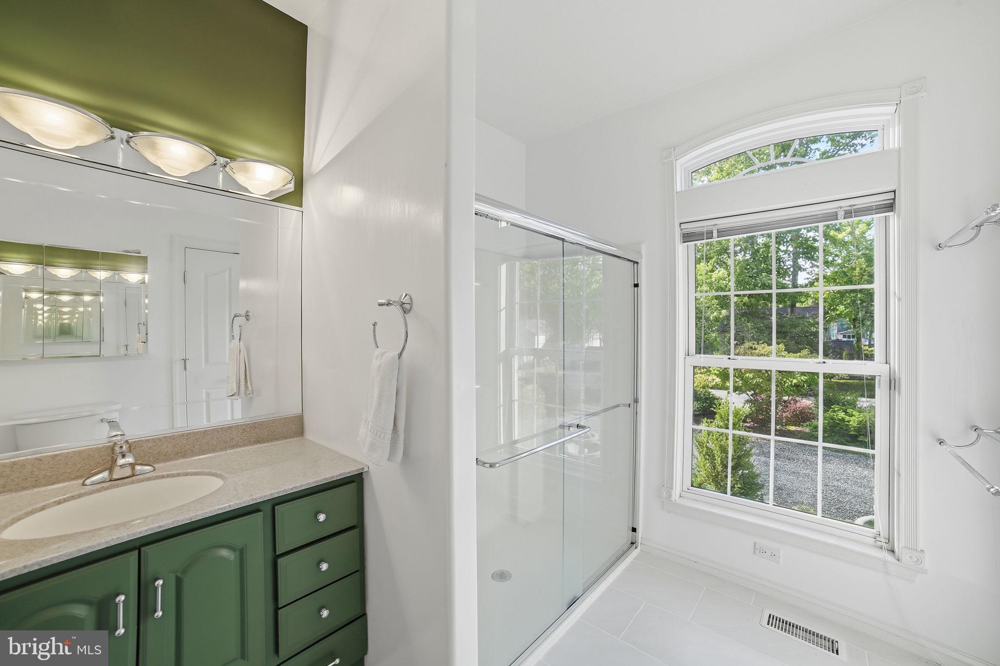 143 Edgemont Circle Locust Grove, VA 22508 - Photo 30 of 85 a bathroom with a granite countertop sink a large mirror a shower and a bathtub