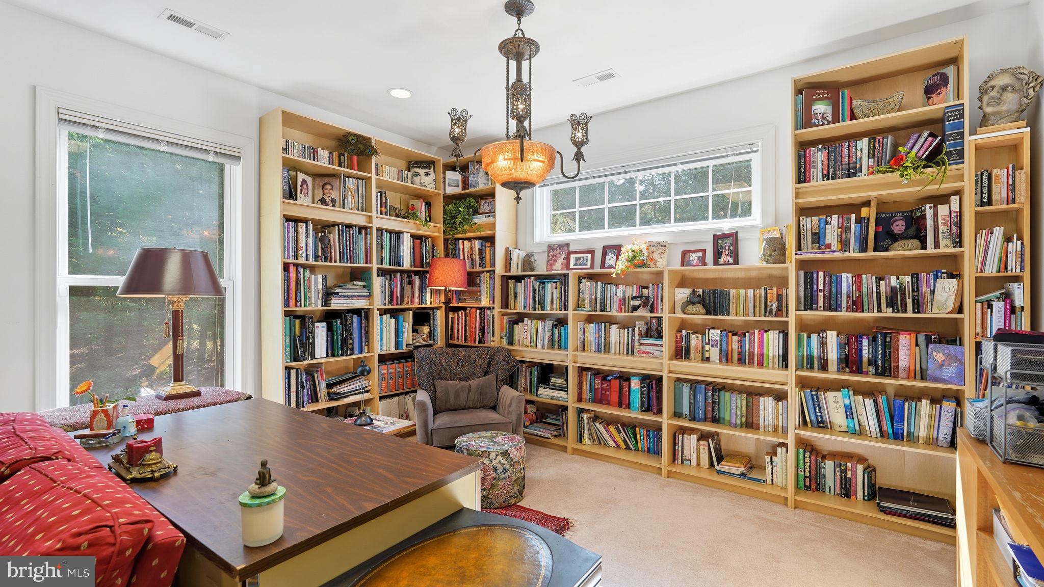 143 Edgemont Circle Locust Grove, VA 22508 - Photo 37 of 80 a living room with large lots of furniture and a book shelf