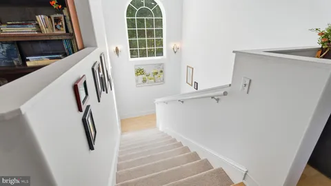 a view of a balcony with chairs