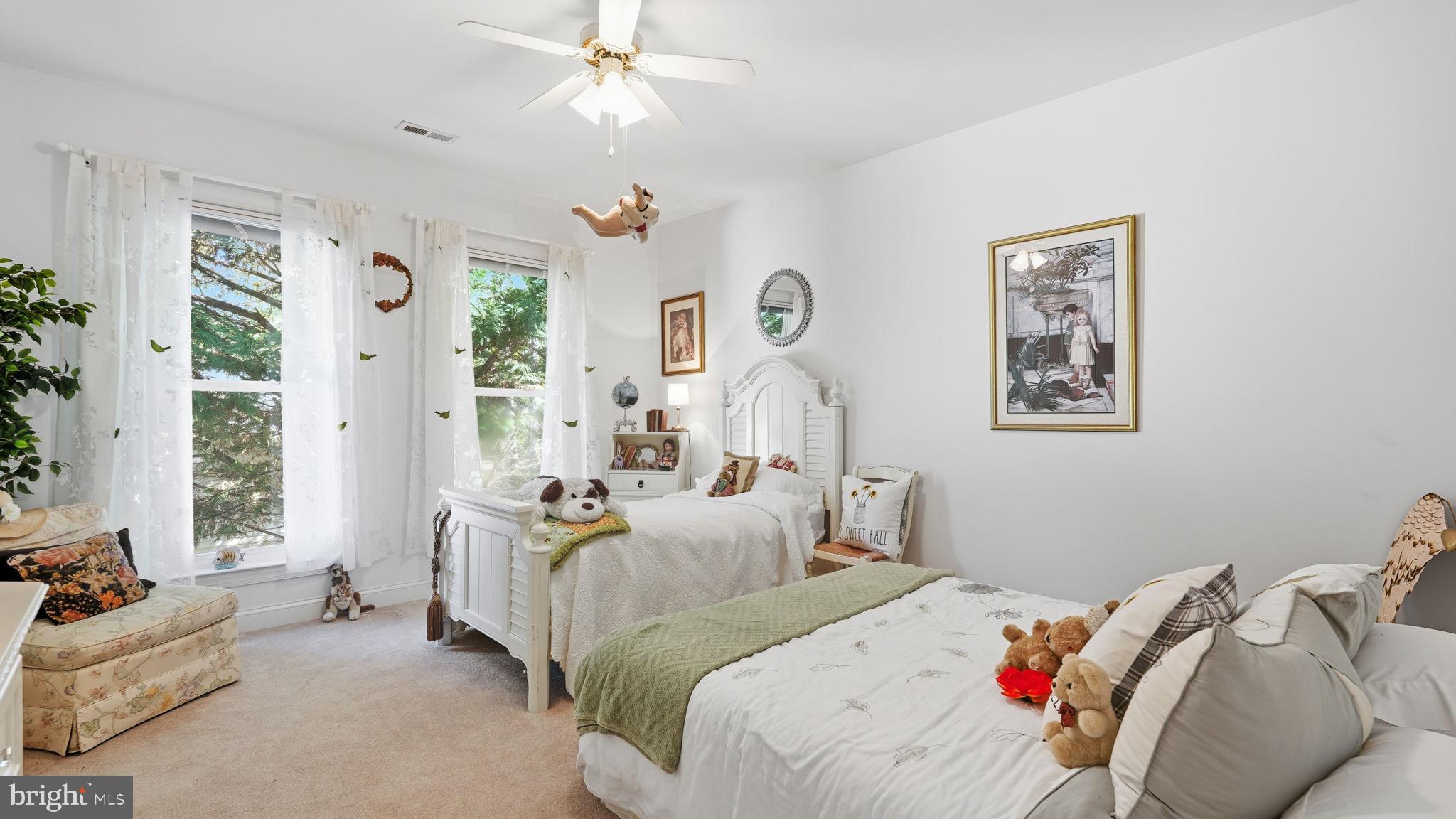 143 Edgemont Circle Locust Grove, VA 22508 - Photo 39 of 85 a bedroom with bed and a chandelier