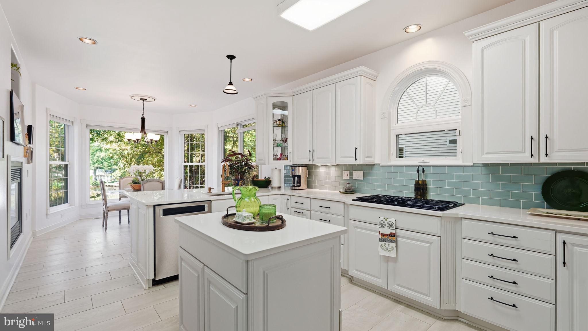 143 Edgemont Circle Locust Grove, VA 22508 - Photo 4 of 80 a kitchen with a white cabinets and chandelier