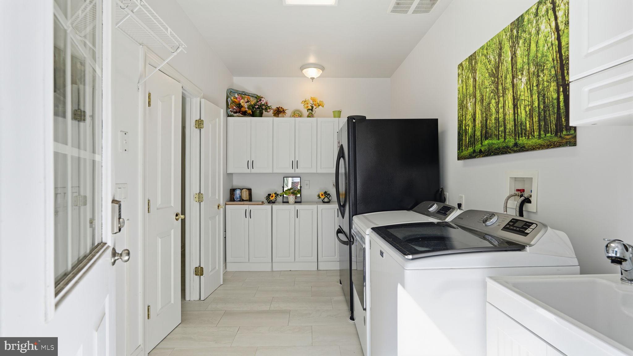 143 Edgemont Circle Locust Grove, VA 22508 - Photo 43 of 85 a bathroom with a sink and a washing machine