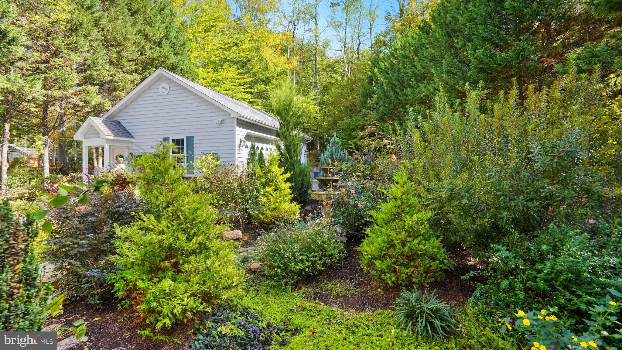 143 Edgemont Circle Locust Grove, VA 22508 - Photo 45 of 80 a view of a house with a yard and potted plants