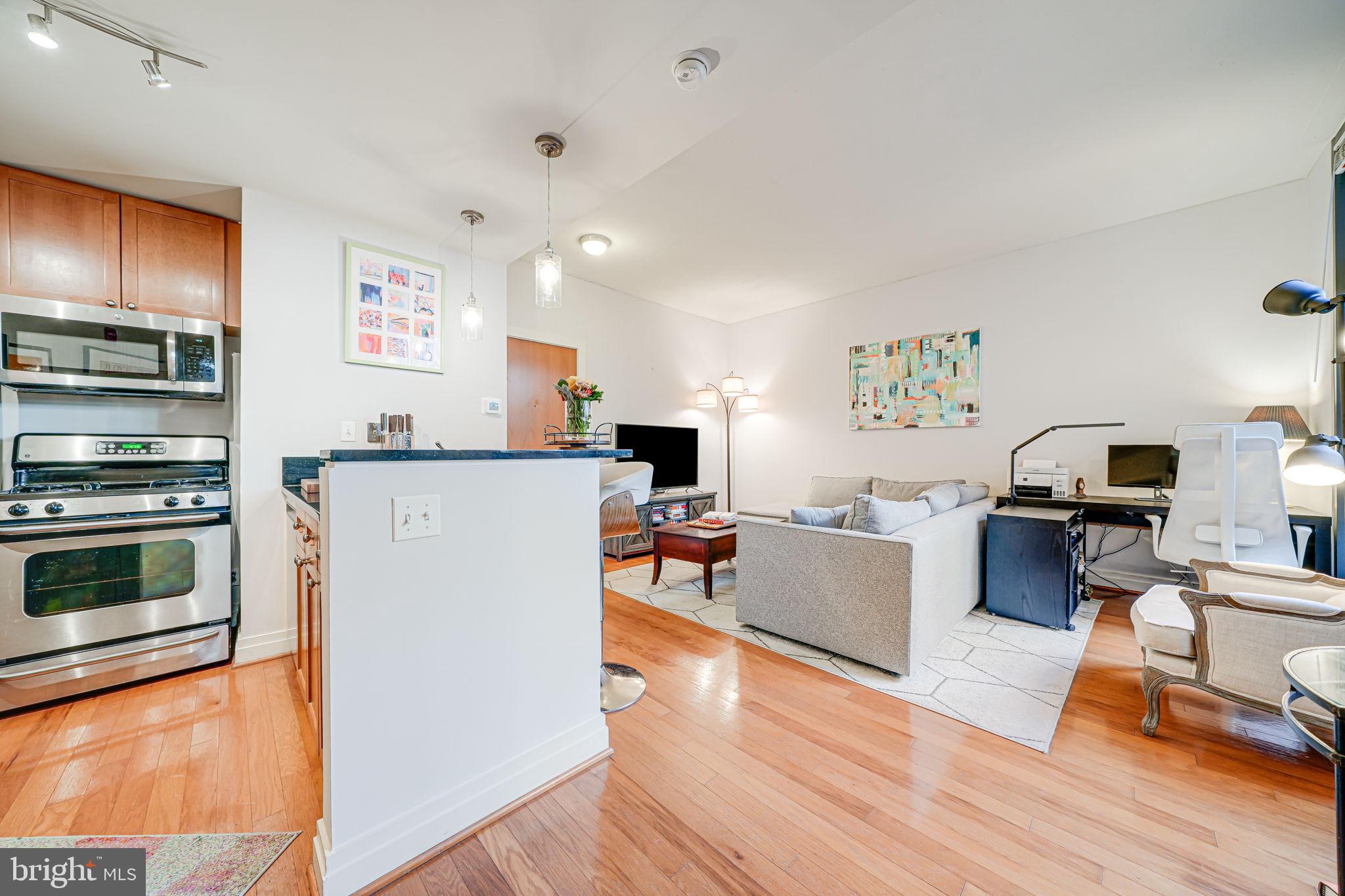2120 Vermont Avenue Northwest, Unit 16 Washington, DC 20001 - Photo 4 of 21 a living room with furniture and a wooden floor